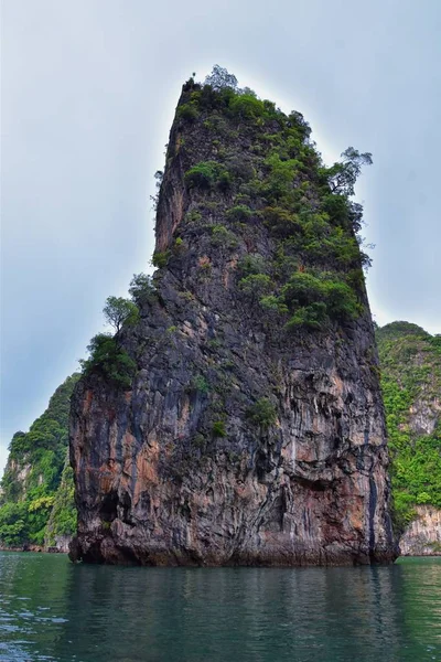 Island, Ocean views near Phuket Thailand with Blues, Turquoise and Greens oceans, mountains, boats, caves, trees resort island of phuket Thailand. Including Phi Phi, Ko Rang Yai, Ko Li Pe and other islands. Asia.