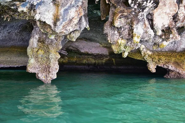 Island, Ocean views near Phuket Thailand with Blues, Turquoise and Greens oceans, mountains, boats, caves, trees resort island of phuket Thailand. Including Phi Phi, Ko Rang Yai, Ko Li Pe and other islands. Asia.