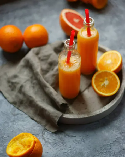 Two bottles of fresh orange juice — Stock Photo, Image