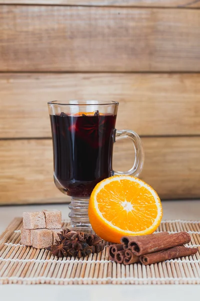 Ingredients for mulled wine: glass orange cinnamon star anise Th Stock Picture