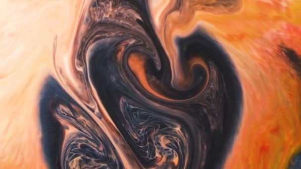 Abstract psychedelic background. Ink is poured into a multicolored liquid with a slow motion — Stock Video