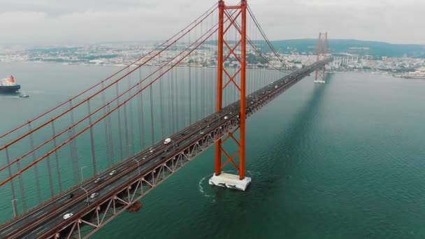 Motion along picturesque red Lisbon bridge with driving cars — Stock Video