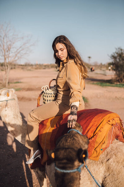 Young woman with a camel in Morocco