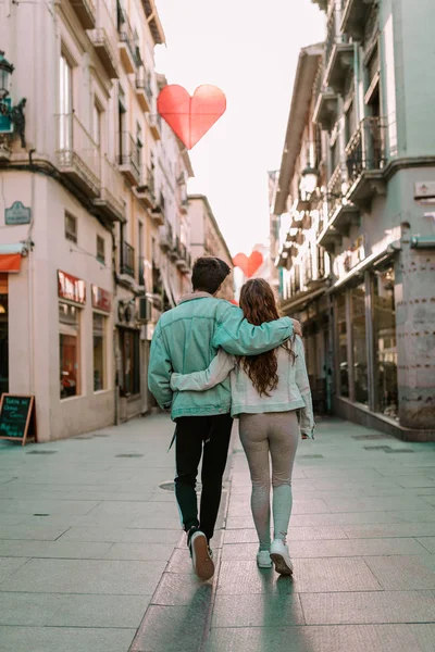 Couple in love walking down the street. Young people walking down the street