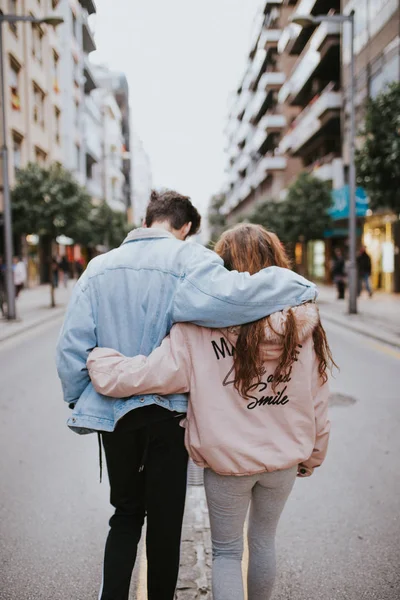 Couple in love walking down the street. Young people walking down the street