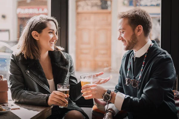 Couple in a cafe having a good time. Couple in love in a cafe.