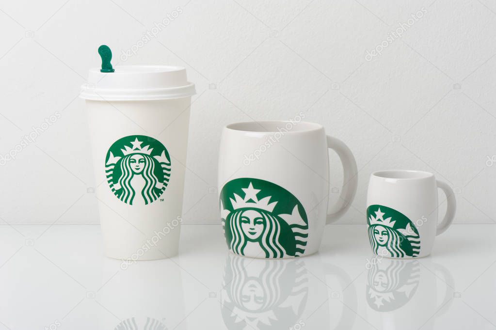 BANGKOK, THAILAND - APRIL 20, 2015: White cups with Starbucks logo. Starbucks is the world's largest coffee house with over 20,000 stores in 61 countries.