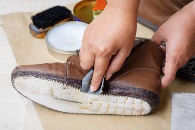 sanding the shoe before apply adhesive, shoe repair clipart