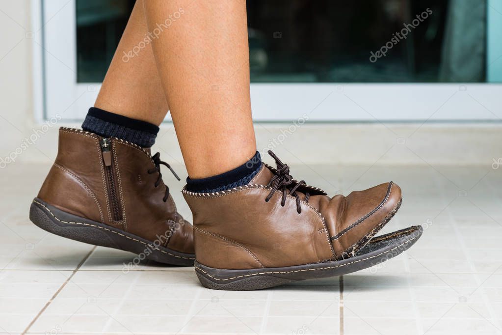 torn women shoe, closeup broken women leather shoe need to repair