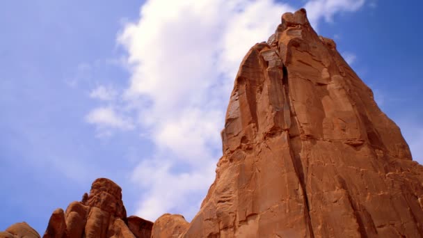 Low angle of tall red cliff in arches national park — Stock Video