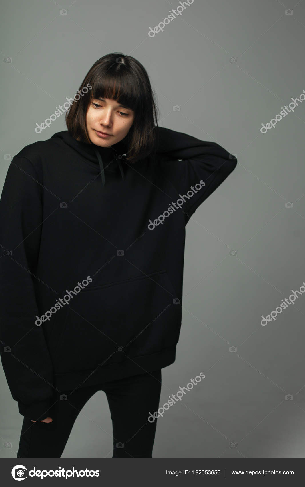 Woman in total black outfit, posing Stock Photo by © 192053656