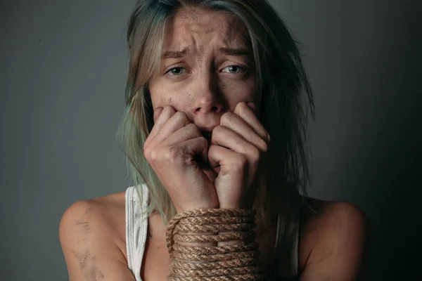 Scared woman with bound hands — Stock Photo, Image