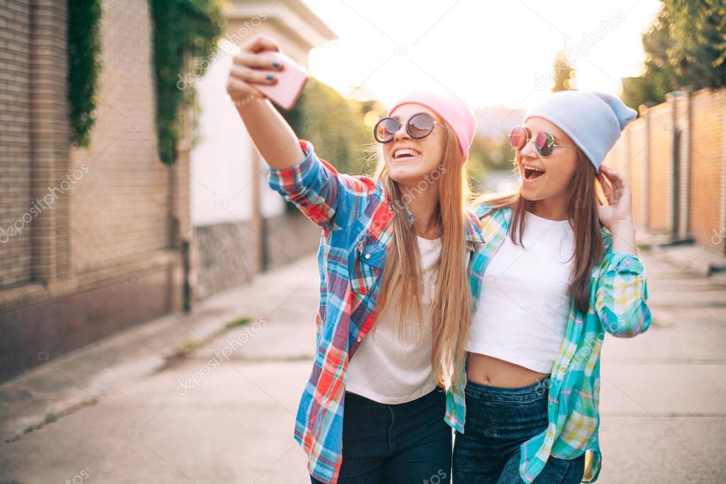 Girls taking selfie on the street