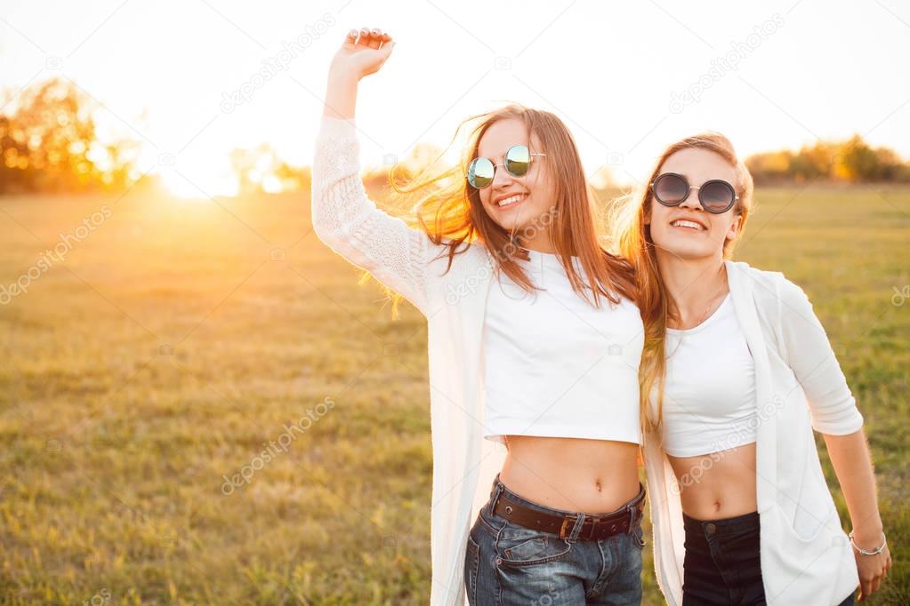 Young girls on field in sunlight