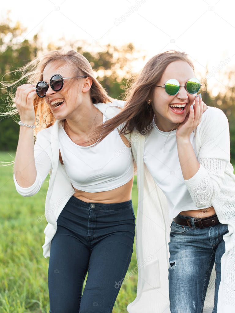 Young girls on field in sunlight