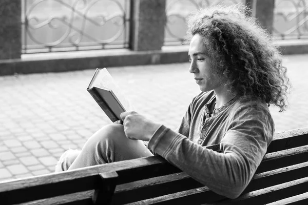 Monochrome Photo Young Man Reading Book Bench — Stock Photo, Image