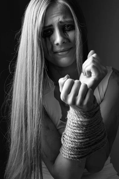 young woman with tied up hands