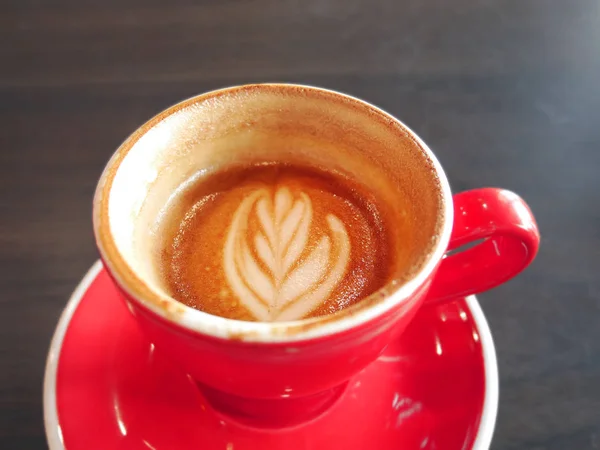 Half cup of latte art coffee — Stock Photo, Image