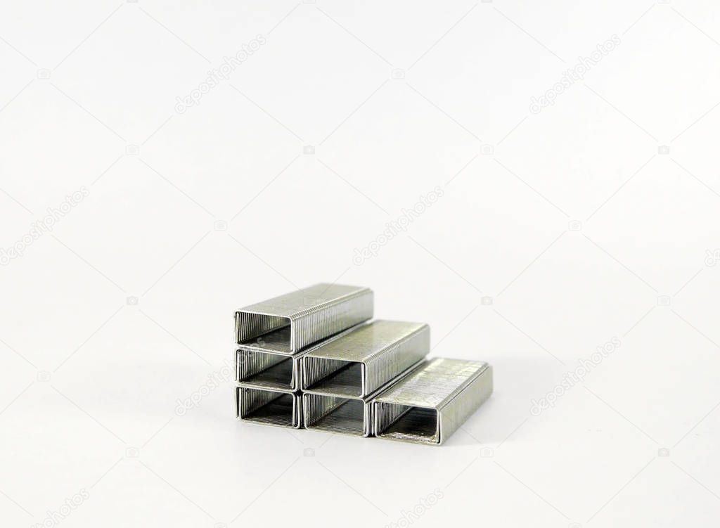 Pile of staples on white background