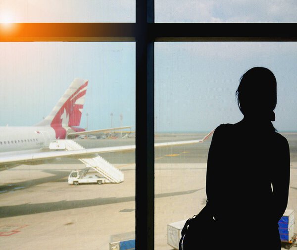 Passenger waiting to get on board a Qatar airways flight to Istanbul, Turkey