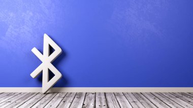 Bluetooth simgesi duvara ahşap zemin üzerinde