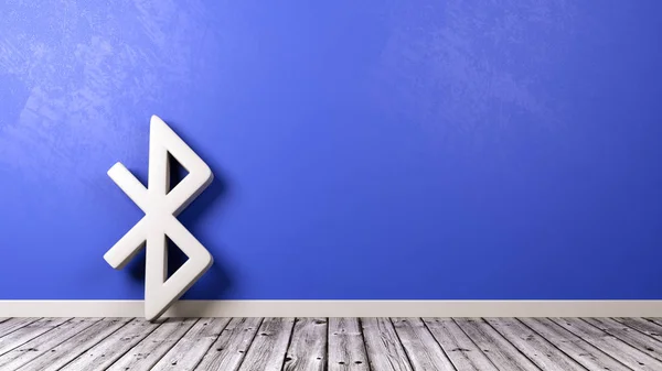 Símbolo Bluetooth no assoalho de madeira contra a parede — Fotografia de Stock