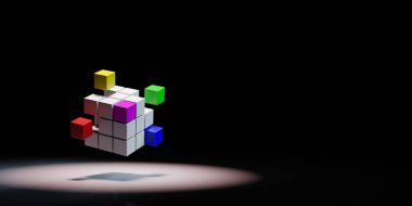 Combining Multicolor Cubes Spotlighted on Black Background clipart