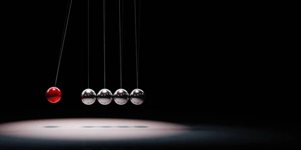 Mecanismo de bolas metálicas iluminado sobre fondo negro — Foto de Stock