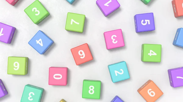 Числа на цветных кубиках на сером фоне — стоковое фото