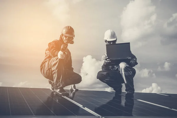 engineers operating and check generating power of solar power pl