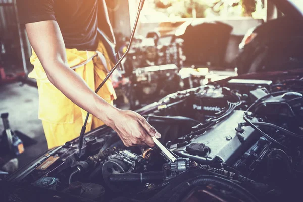 Technician working on checking and service car in  workshop gara — Stock Photo, Image