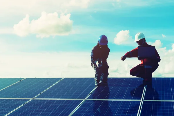 engineers operating and check generating power of solar power pl