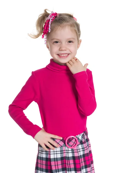 Happy little girl stands against the white — Stock Photo, Image