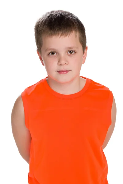 Young boy stands on the white background — Stock Photo, Image