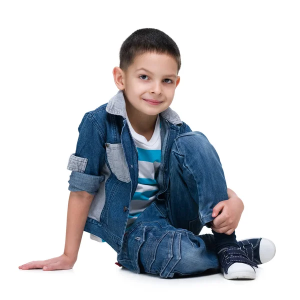 Cute little boy sits on the white background — Stock Photo, Image