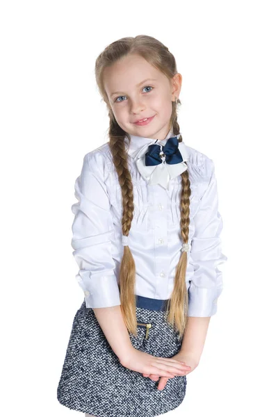 Smiling schoolgirl against the white — Stock Photo, Image