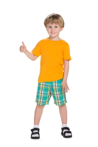 Little blond boy holds his thumb up Royalty Free Stock Photos