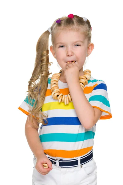 Niña comiendo panecillos Imágenes De Stock Sin Royalties Gratis