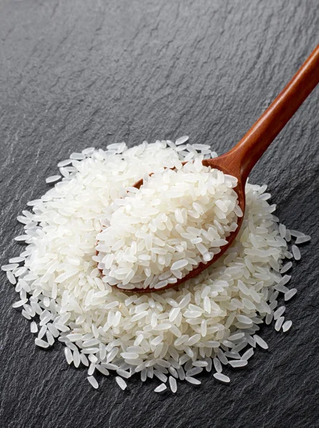 Rice Wooden Spoon Black Stone Background — Stock Photo, Image