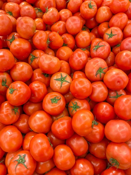 Big pile of flawless red tomatoes for backgrounds concept — ストック写真