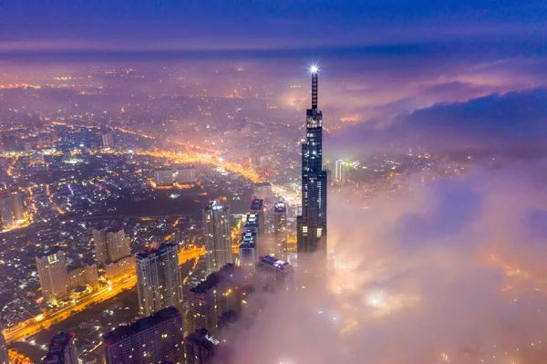 Aerial view of Saigon cityscape at night with misty sky — Stock Photo, Image
