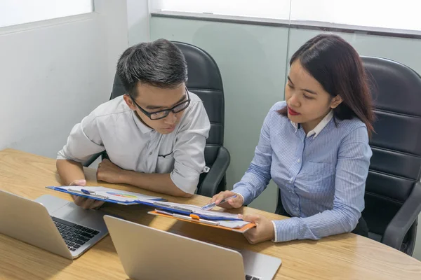 Business employee reading information on sales report