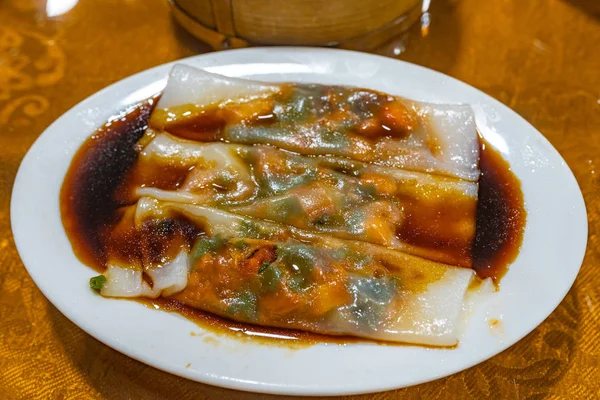 Hong Kong steamed rice rolls served with soy sauce