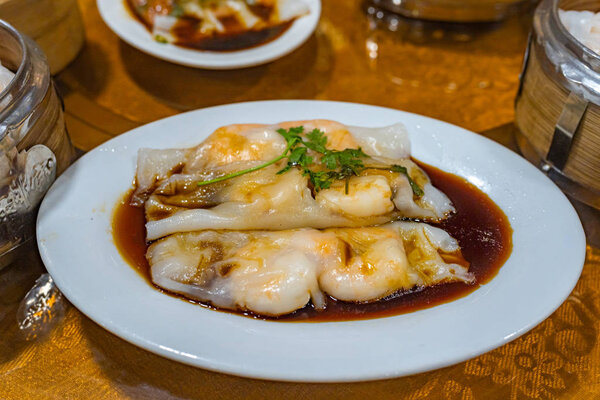 Plate of delicious steamed shrimp rice rolls in dimsum restaurant