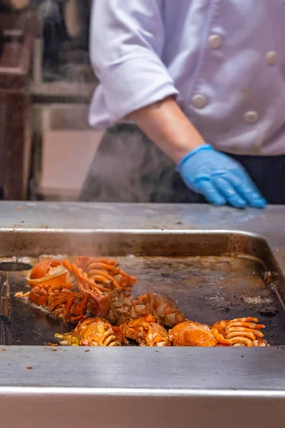 The restaurant chef grilling delicious crayfish in kitchen — 스톡 사진