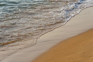 Peaceful and beautiful beach with small waves