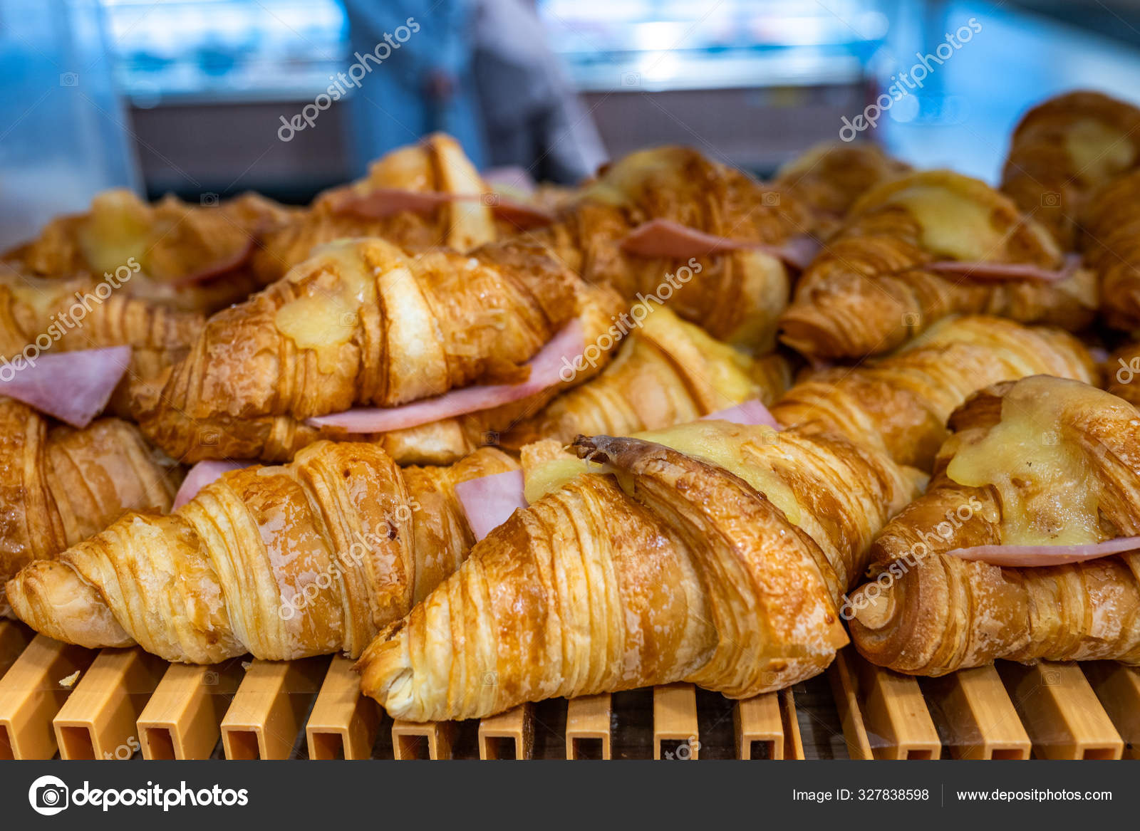 Croissant with melted cheese and ham selling at pastry shop Stock Photo