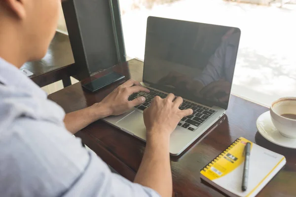 Man using laptop to search information