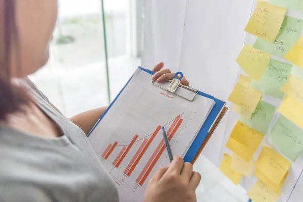 Office worker reading financial report