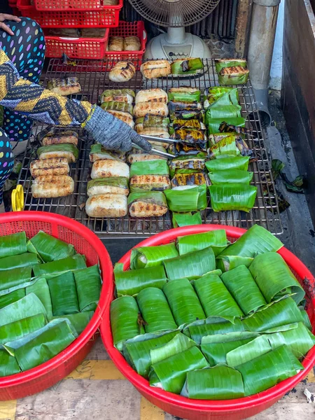 Cambodia street food- grilled sticky rice wrapped with banana leaf
